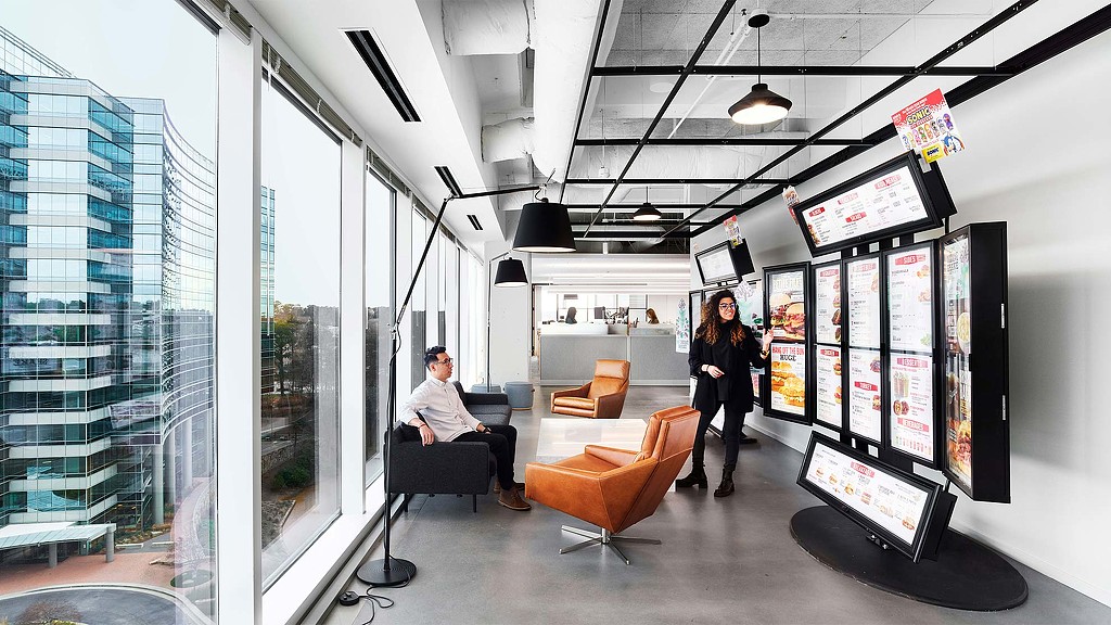 A man and woman in an office.